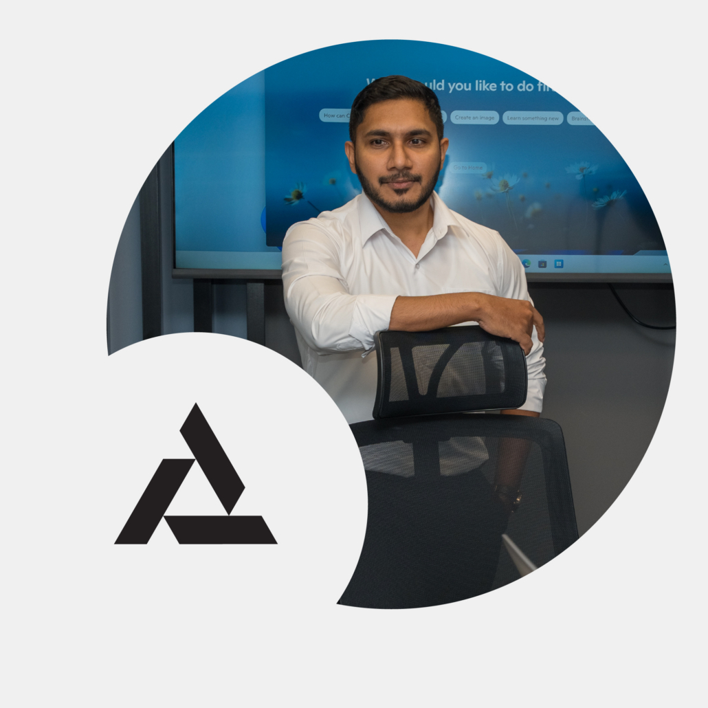 Team member leaning on chair